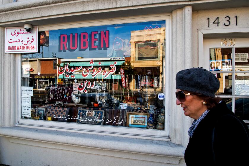 WESTWOOD, CA - FEBRUARY 23, 2019: A woman walks by a silver store, Ruben, on Westwood Boulevard in Westwood. (Michael Owen Baker / For The Times)