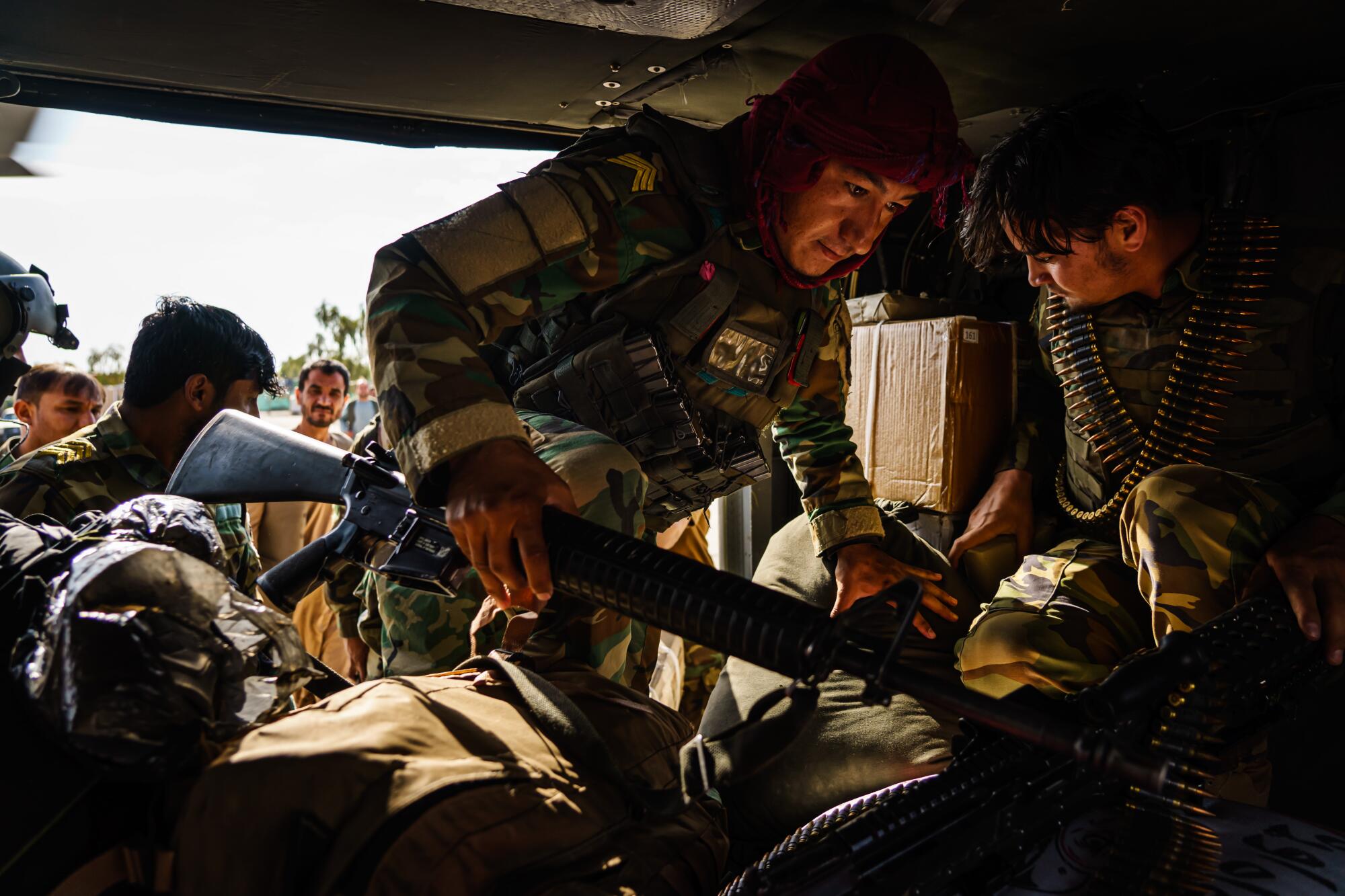 Soldiers board a UH-60 for a resupply mission to an outpost north of Kandahar, Afghanistan