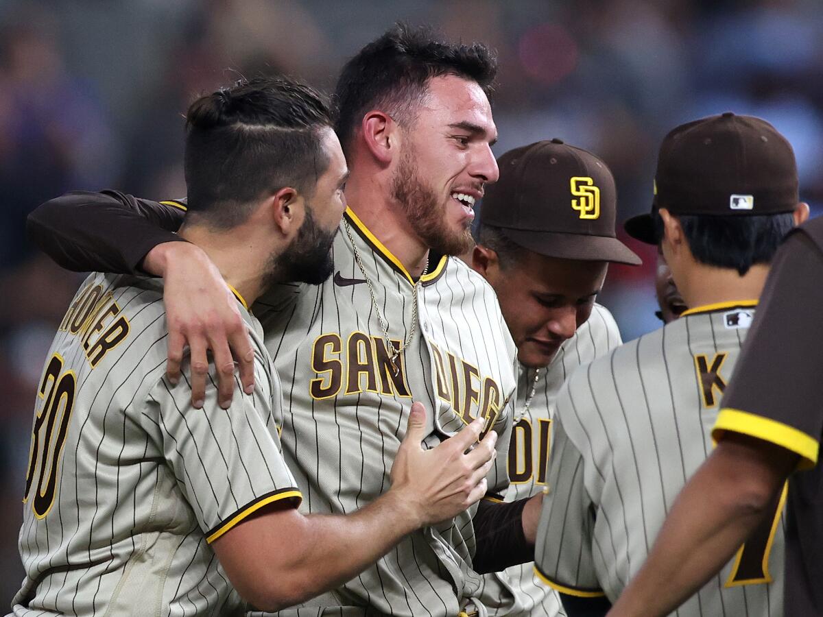 Joe Musgrove celebrates with teammates after pitching a no-hitter against the Texas Rangers.