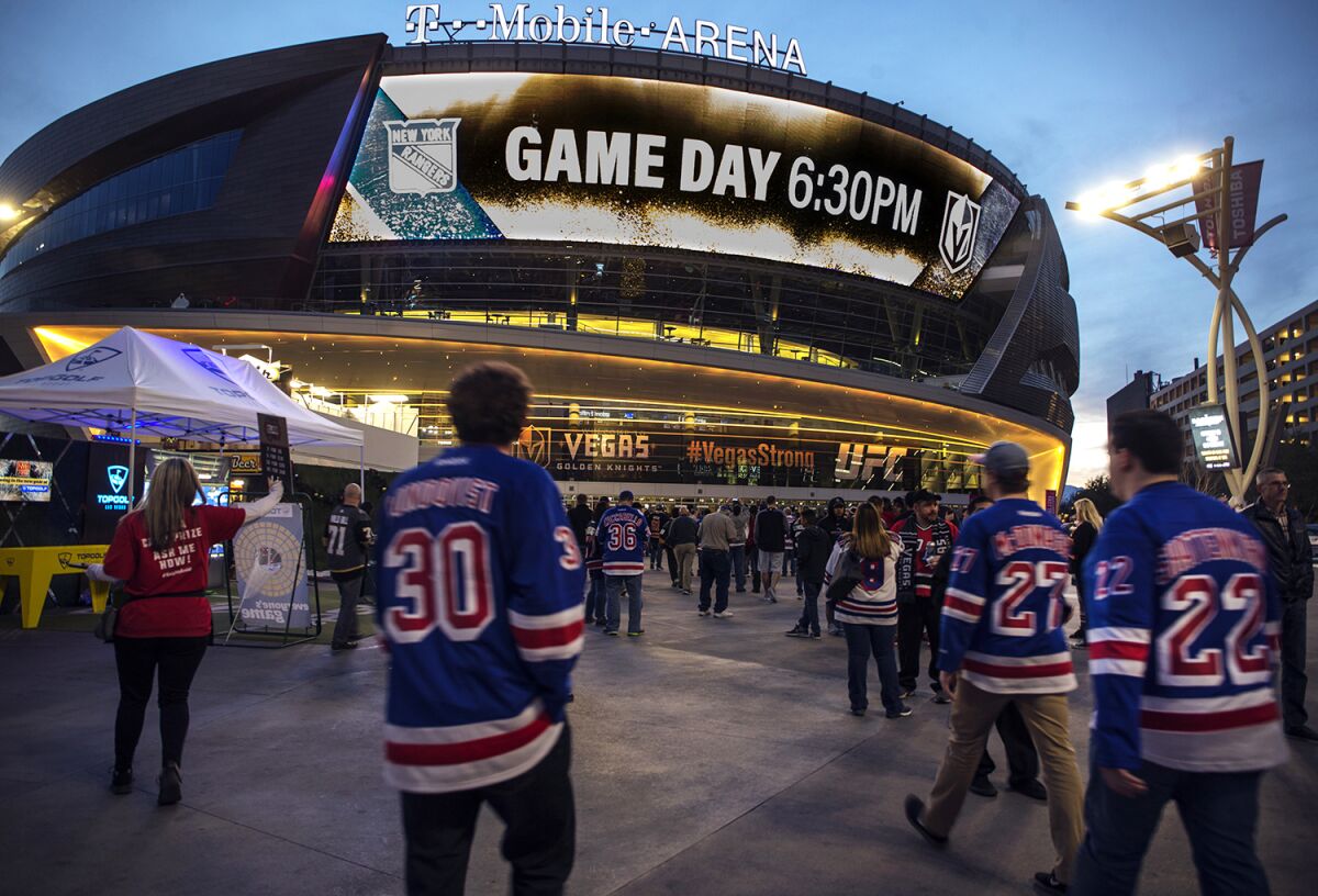 Fans of the New York Rangers walk into T-Mobile Arena in Las Vegas.