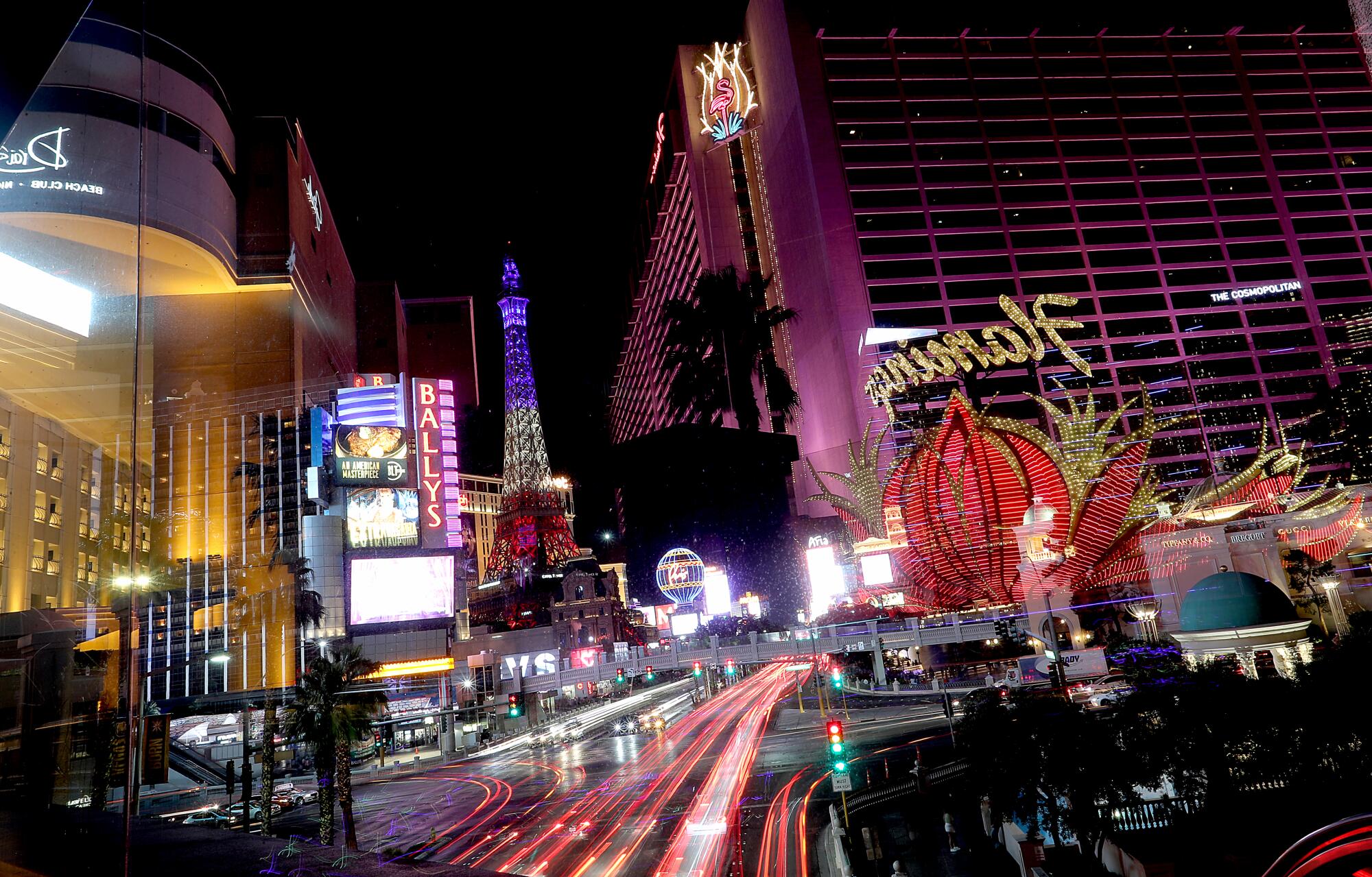 The lights of the Las Vegas Strip glow at the intersection of Las Vegas Boulevard and Flamingo Road. 