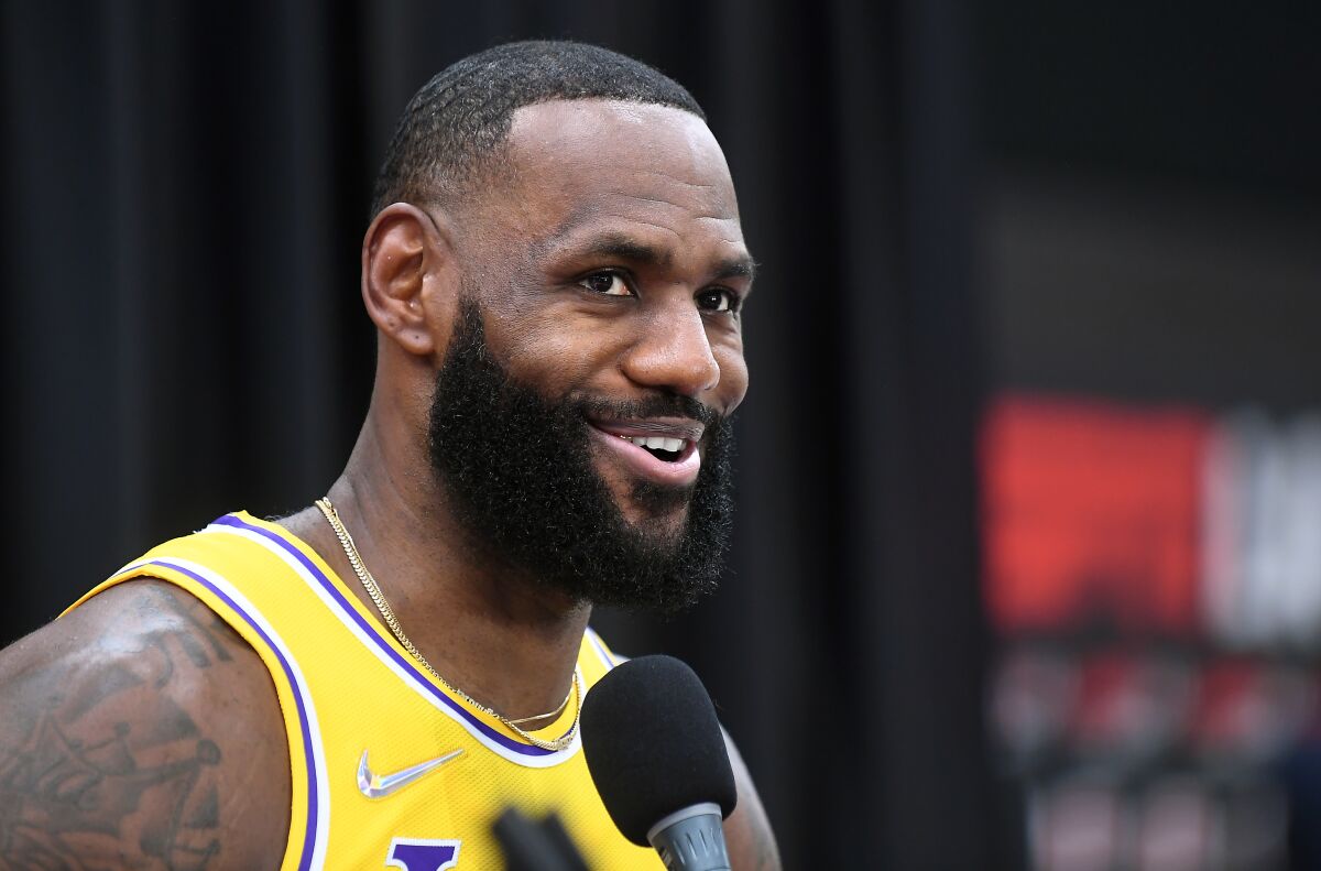 Lakers forward LeBron James answers a question during media day.