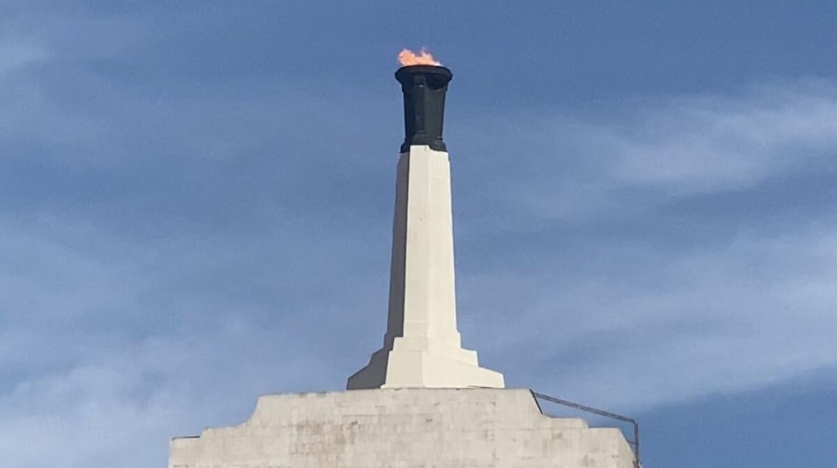 The flame was lighted at the Coliseum on Thursday during a return to high school football.