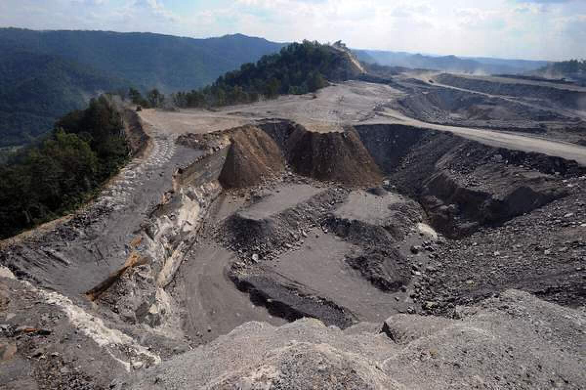 A mountaintop removal mining site at Kayford Mountain, W.Va., with Coal River Mountain, left, in the background.