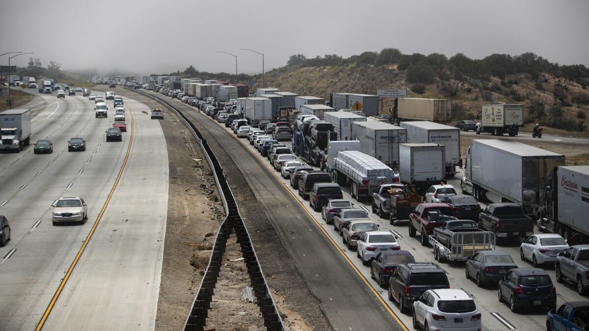 Traffic is backed up all the way to Hesperia after a pileup in dense fog on the southbound 15 Freeway in the Cajon Pass.