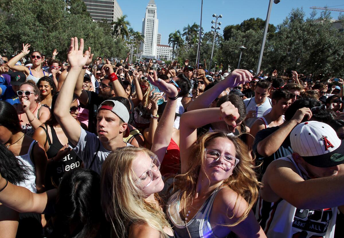 Fans dance to the music as Classixx performs at the Made In America Festival in downtown Los Angeles on Sunday.