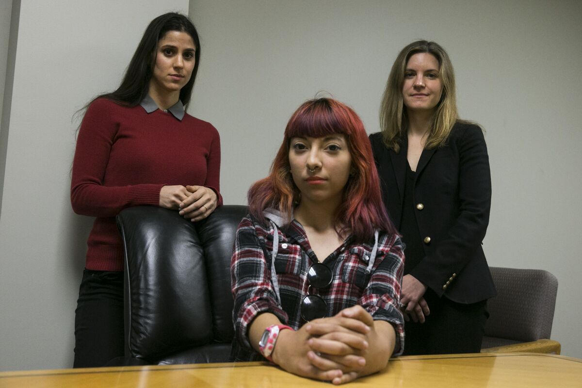Compton Unified student Kimberly Cervantes, center, is part of a groundbreaking class-action lawsuit seeking academic and counseling services from the district, where students allegedly are suffering from extensive trauma, which research shows incapacitates learning. The lawsuit is the first of its kind in the nation. Left to right are; attorney Annie Hudson-Price, Cervantes and attorney Kathryn Eidmann.