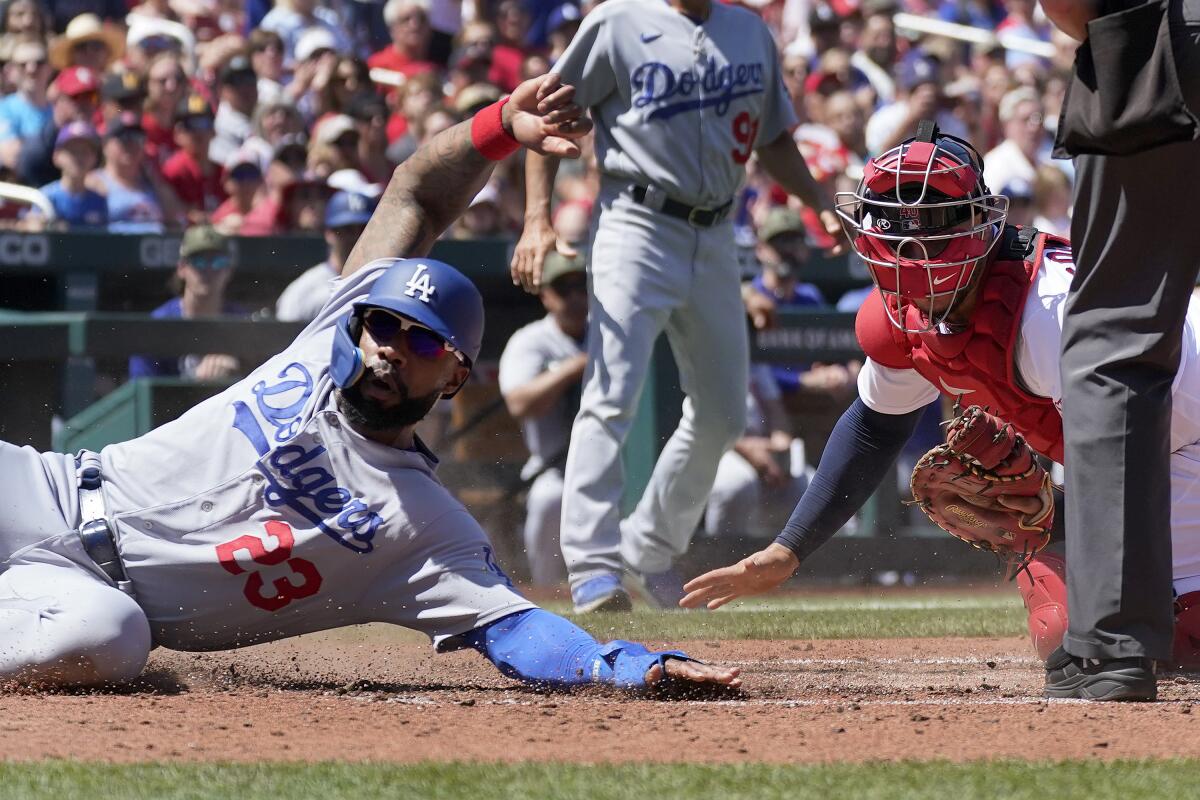 Jason Heyward avoids being tagged out by St. Louis Cardinals catcher Willson Contreras.