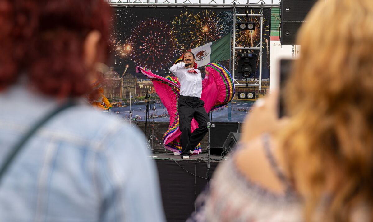 The ballet folklorico group Nuevo Amanecer performs on stage at the Fiestas Patrias carnival.