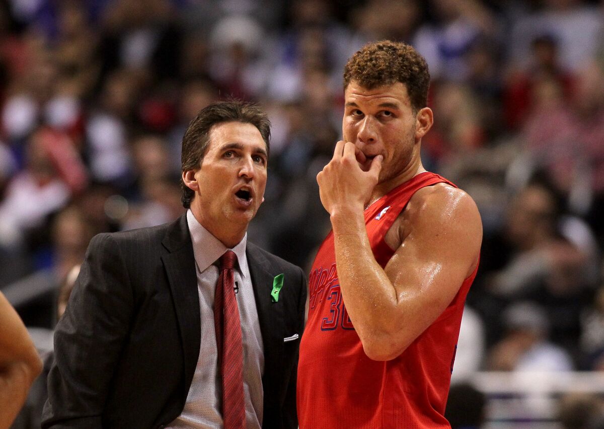 Clippers coach Vinny De Negro speaks to Blake Griffin during a game against the Denver Nuggets on Christmas Day 2012.