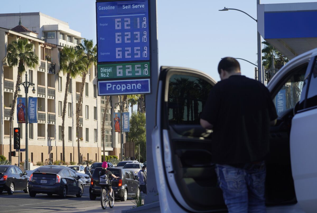 A motorist pauses at a gas station in downtown Los Angeles. 