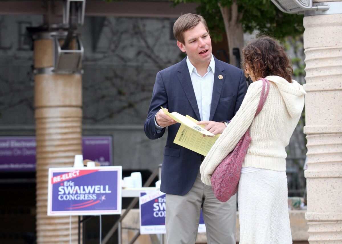Rep. Eric Swalwell (D-Dublin) passes out fliers to commuters in Castro Valley.