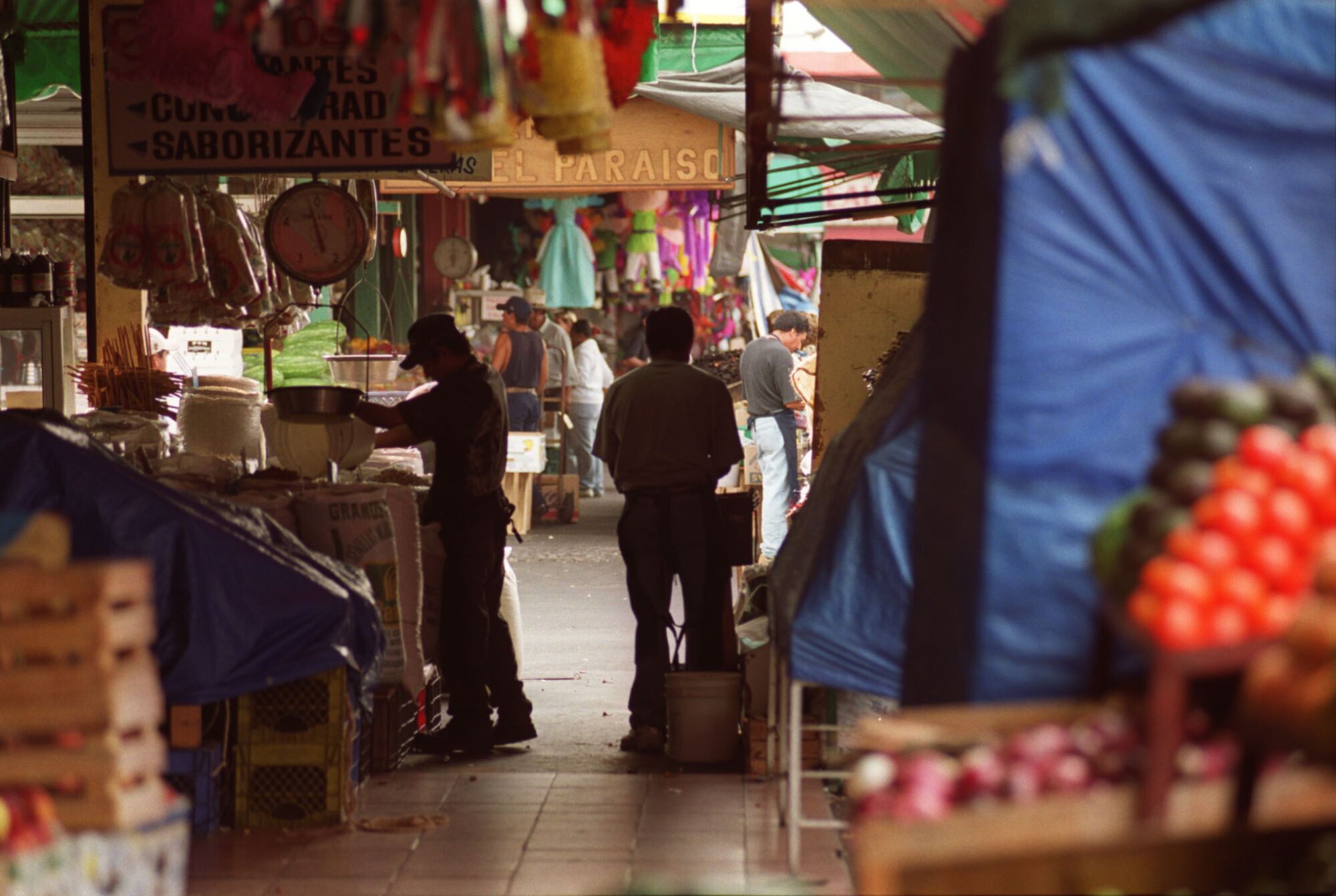 Workers prepare for the day at Tijuana's Mercado Hidalgo in August 2000.