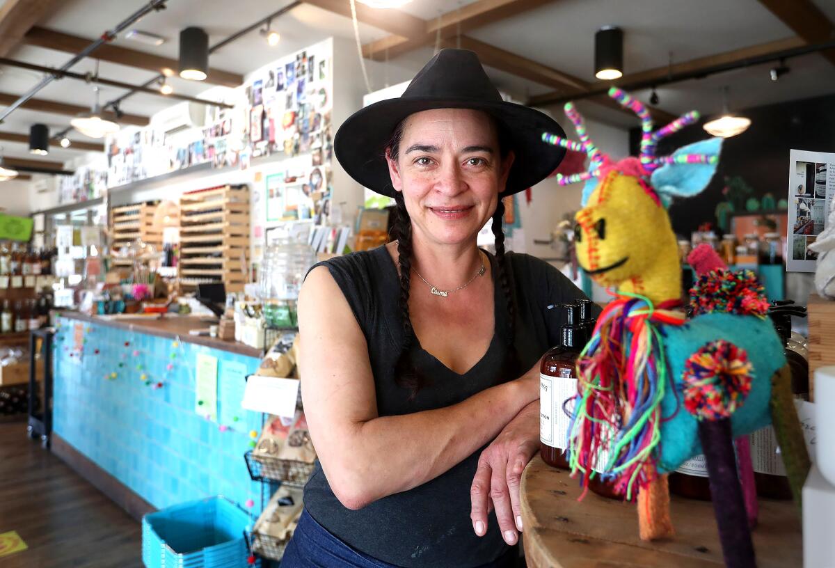 Alta Baja Market and cafe owner Delilah Snell stands in her store in the 4th Street Market.