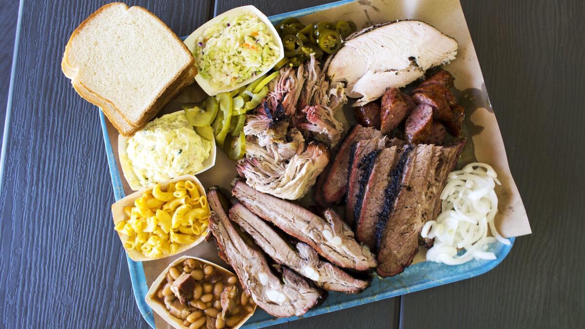 A smorgasbord of items from the menu at Ray's BBQ includes pork ribs, beef brisket, pulled pork, turkey breast and sausage.