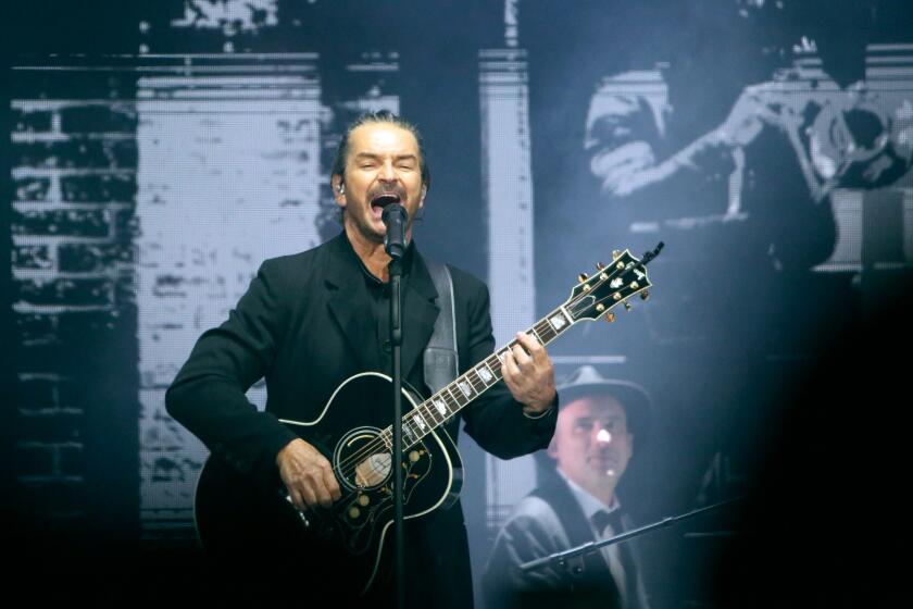 Latin singer Ricardo Arjona performs at the Crypto.com Arena during his Black and White Tour, in Los Angeles on Sunday, May 1, 2022.