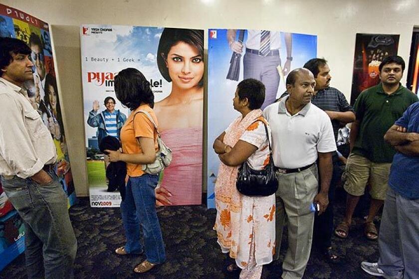 Moviegoers line up in the lobby of San Jose's Towne Theatre, which features Indian movies exclusively. Operator Big Cinemas aims to build the nation's first theater circuit catering to Indian Americans and other ethnic groups passed over by the major chains.