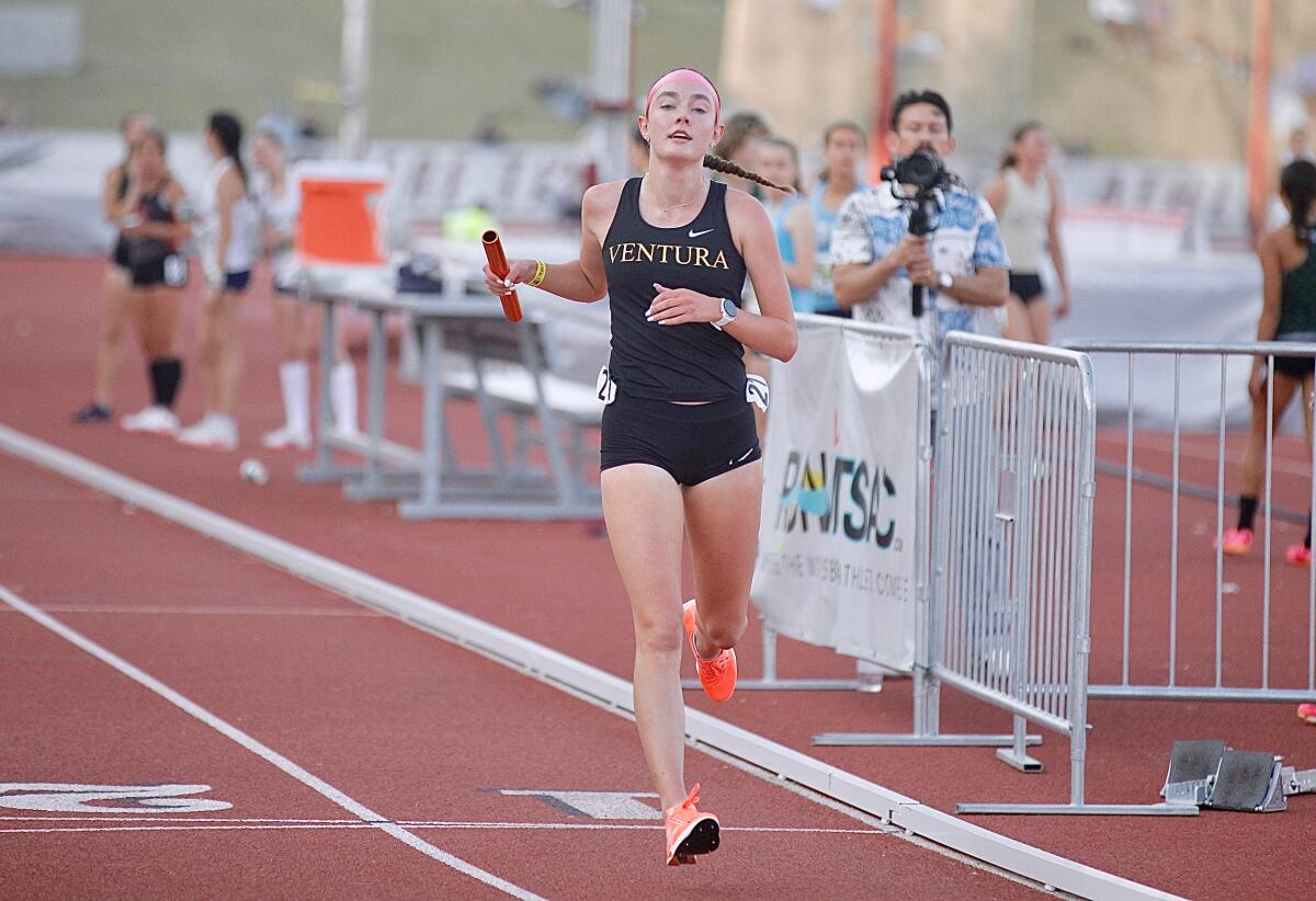 Sadie Engelhardt reaches the finish line after running a 1,600-meter split of 4:33.95.