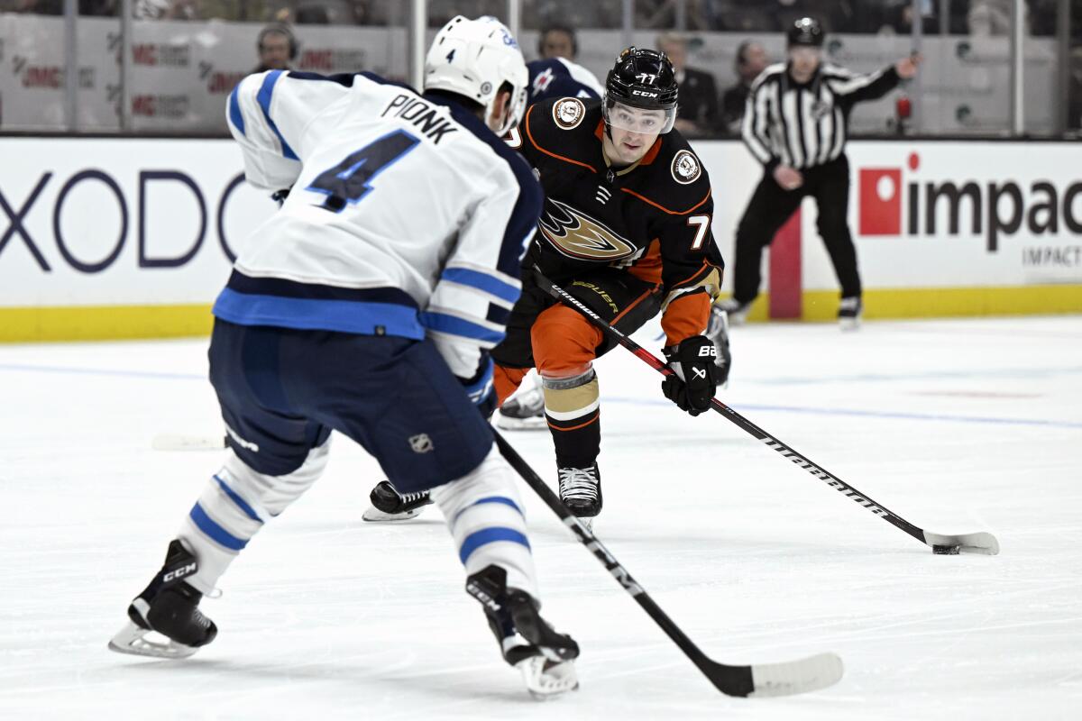 Ducks right wing Frank Vatrano shoots against Winnipeg Jets defenseman Neal Pionk during the first period.
