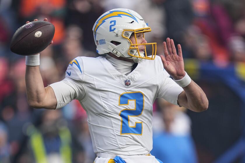 Los Angeles Chargers quarterback Easton Stick (2) passes in the pocket against the Denver Broncos.