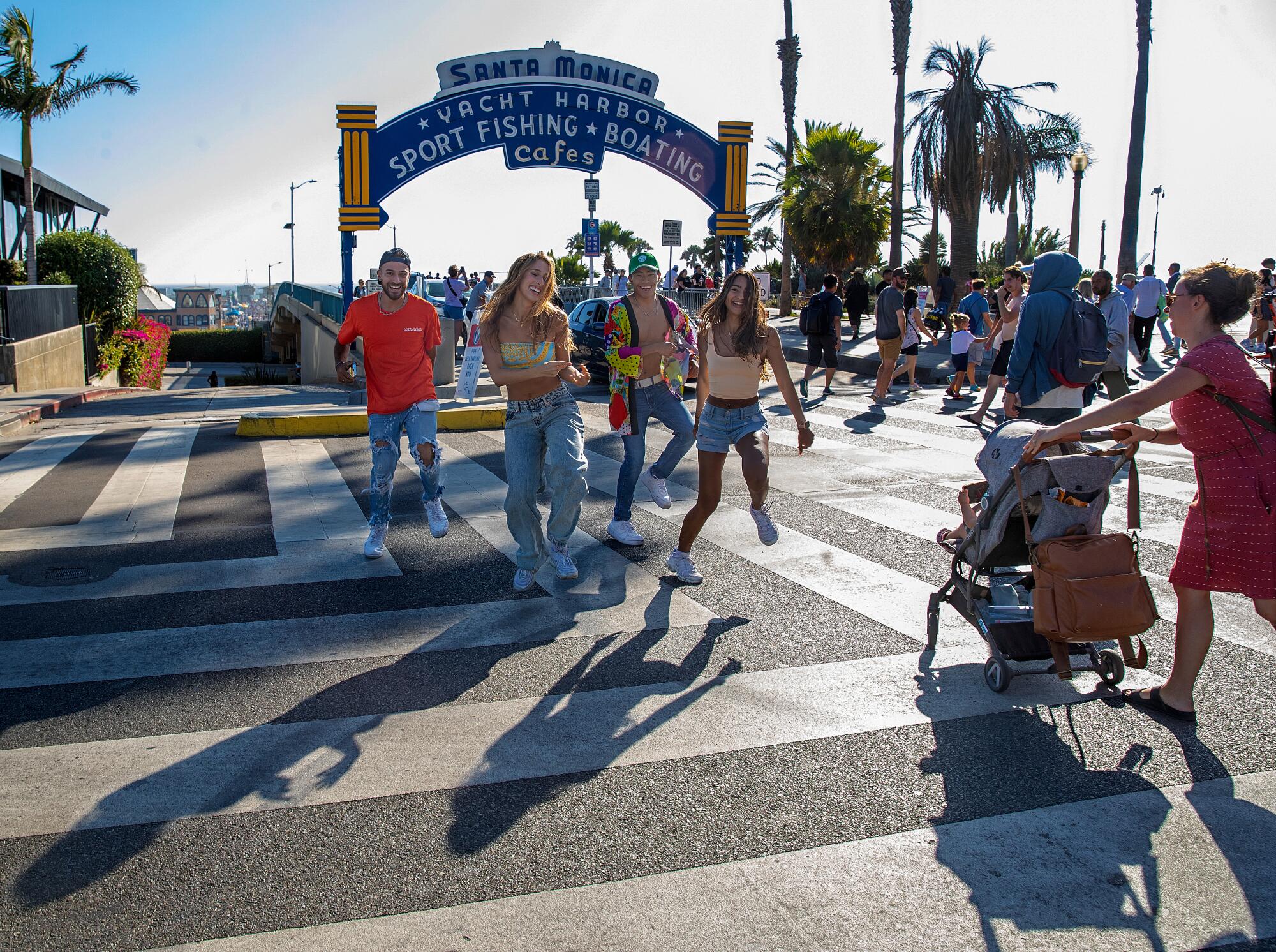 A group of people dancing while strangers walk around them.