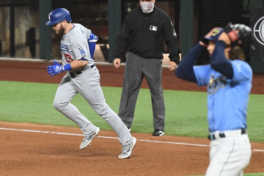 ARLINGTON, TEXAS OCTOBER 25, 2020-Dodgers Max Muncy rounds the bases after his solo home run.
