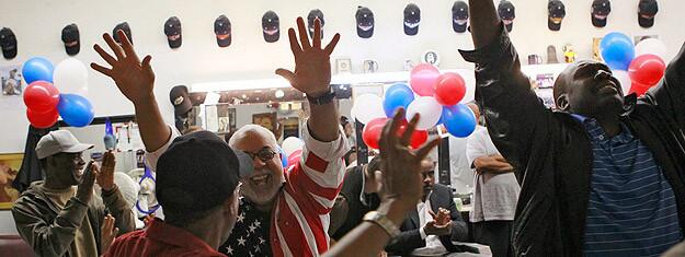 Dozens of people at Tolliver's Barber Shop in Los Angeles celebrate the news that President Obama had won Ohio.
