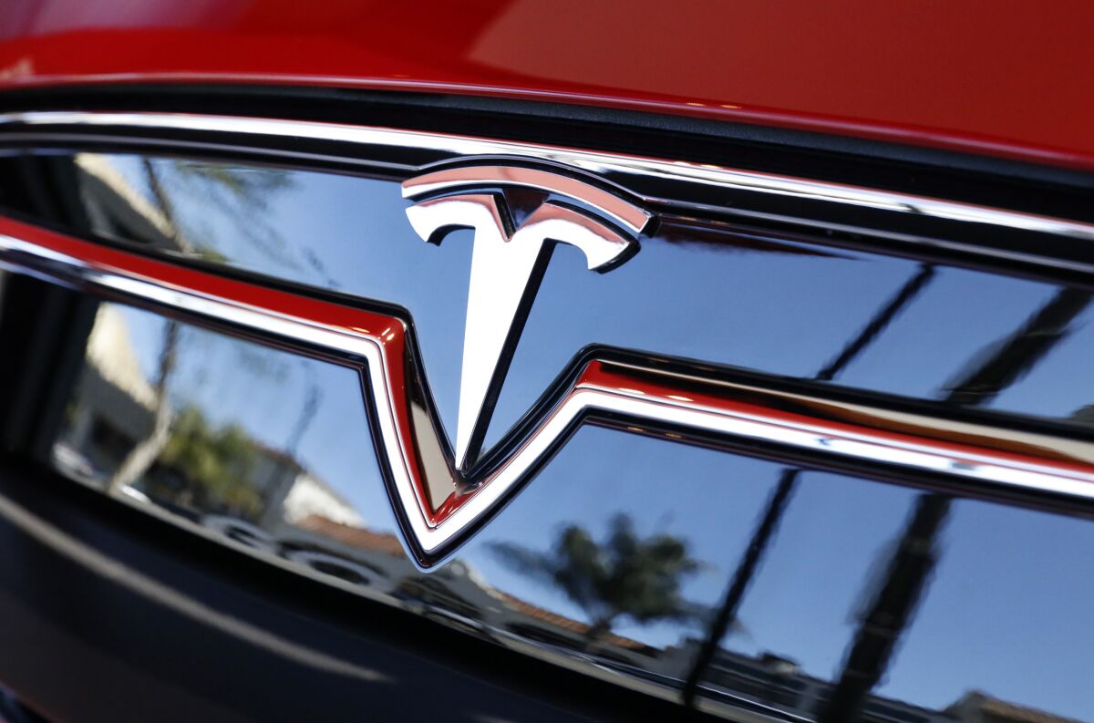 The logo on a Tesla car