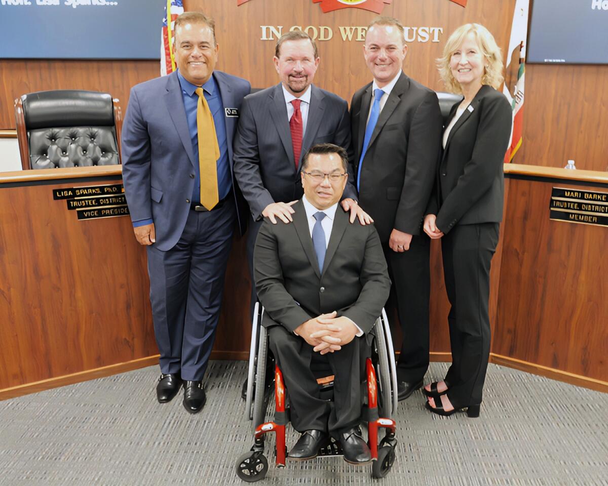 Orange County Board of Education trustees pose with newly appointed Supt. Dr. Stefan Bean.