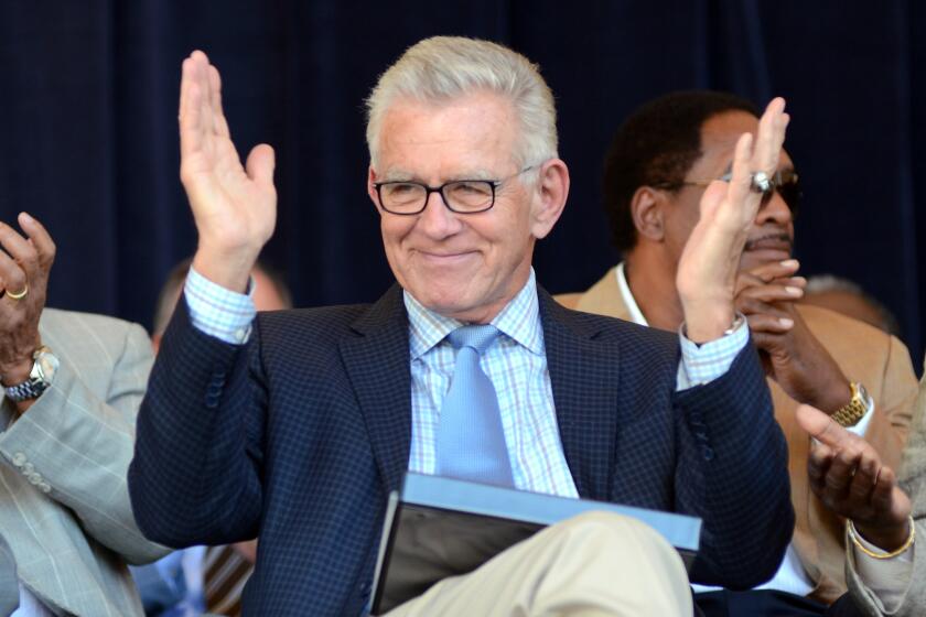 FILE - In this July 21, 2012, file photo, Tim McCarver greets the crowd before accepting the Ford C. Frick Award.