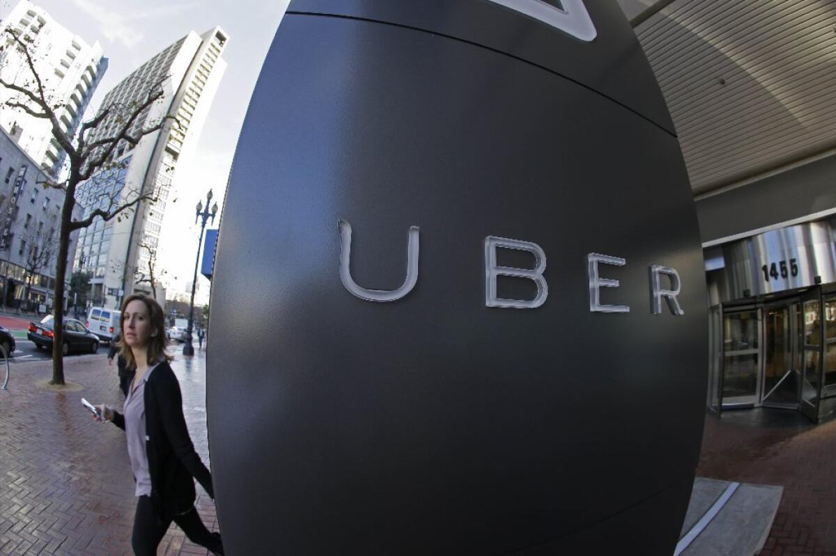 A woman leaves the headquarters of Uber in San Francisco.