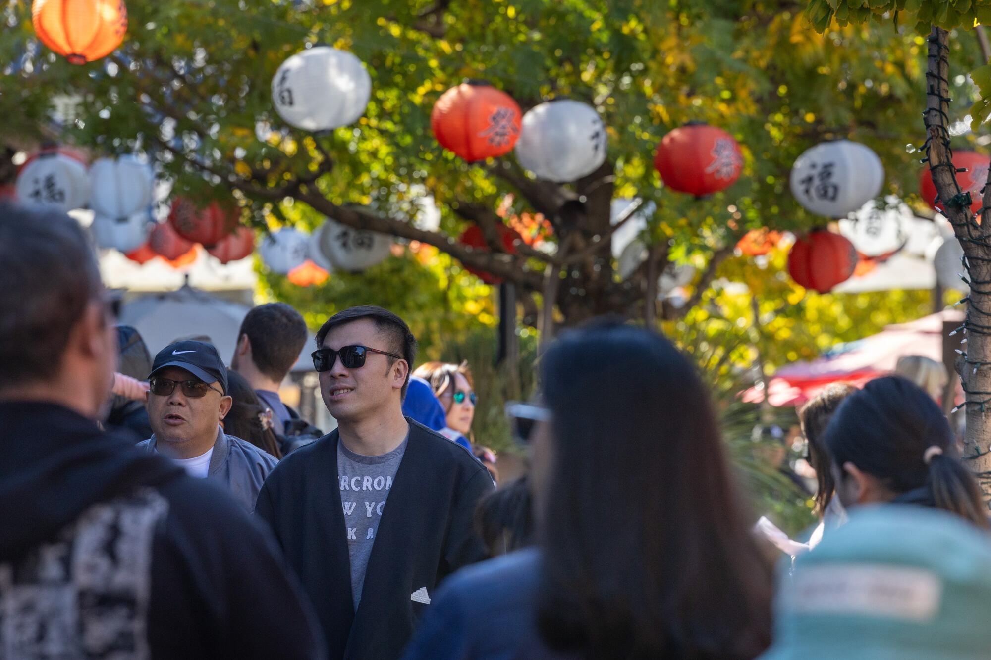 Visitors walk in the Japanese Village Plaza in Little Tokyo.