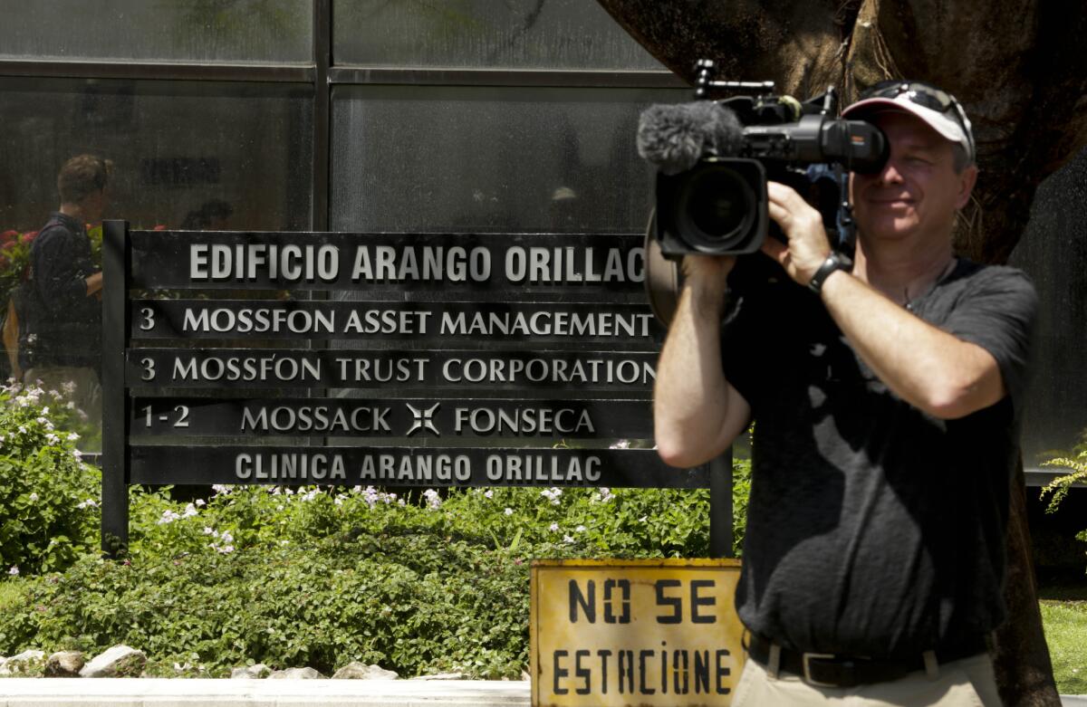 A cameraman films outside the Arango Orillac Building--which lists the Mossack Fonseca law firm as a tenant--in Panama City, Panama, on April 5.