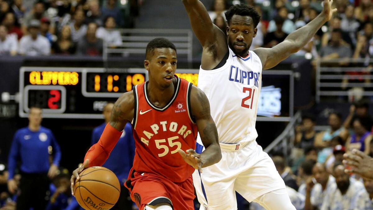 Clippers guard Patrick Beverley pressures Raptors guard Delon Wright as he brings the ball up the court during a preseason game.