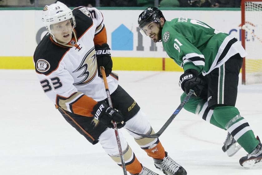 Ducks right wing Jakob Silfverberg, left, takes control of the puck in front of Dallas Stars center Tyler Seguin during the first period on Tuesday.