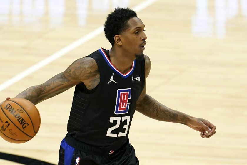 Los Angeles Clippers guard Lou Williams (23) dribbles during an NBA basketball game against the Golden State Warriors.