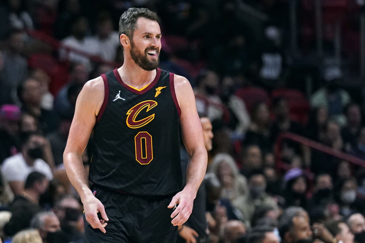 Cleveland Cavaliers forward Kevin Love smiles after a play during the second half of an NBA basketball game against the Miami Heat, Wednesday, Dec. 1, 2021, in Miami. Love, a five-time NBA All-Star, is being honored by a Boston foundation for his work on and off the court to take the stigma out of mental health struggles. (AP Photo/Wilfredo Lee)