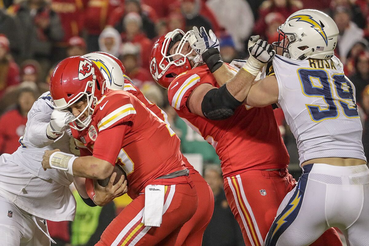 Chargers linebacker Melvin Ingram sacks Chiefs quarterback Patrick Mahomes during a game in 2018.