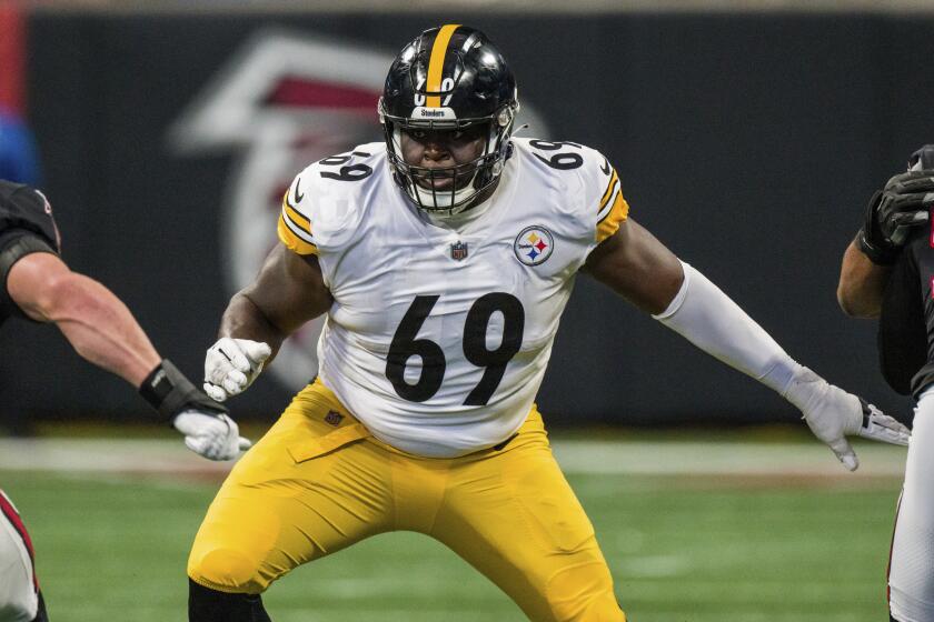 Pittsburgh Steelers guard Kevin Dotson (69) works during the first half of an NFL football game.
