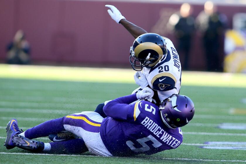 Rams defensive back Lamarcus Joyner delivers an elbow to Vikings' Teddy Bridgewater as the quarterback slides down.