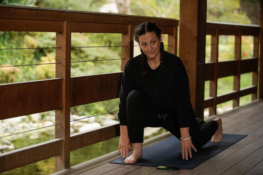 San Diego, CA - December 18: Instructor, Emily Aust leads a yoga class at the Japanese Friendship Garden in Balboa Park on Monday, Dec. 18, 2023 in San Diego, CA. (Alejandro Tamayo / The San Diego Union-Tribune)