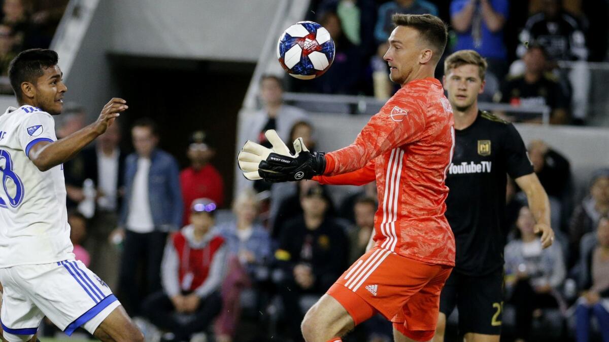 LAFC goalkeeper Tyler Miller, right, makes a save against Montreal Impact midfielder Shamit Shome on May 24. Miller is one of three LAFC players on the U.S. national team's preliminary roster for the CONCACAF Gold Cup.