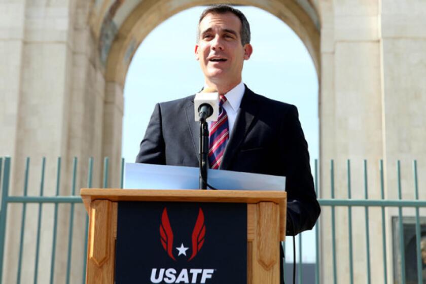 Mayor Eric Garcetti speaks at a USATF news conference at the Coliseum on Wednesday to announce Los Angeles as the host city for the 2016 U.S. Olympic marathon trials.