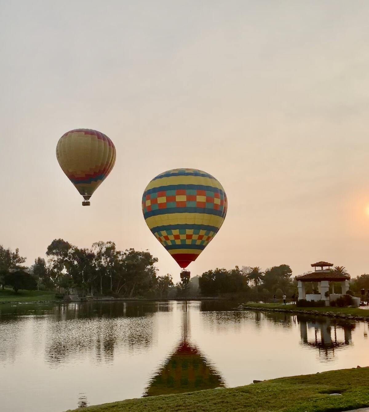 Balloons in the sky over Fairbanks Ranch Lake.