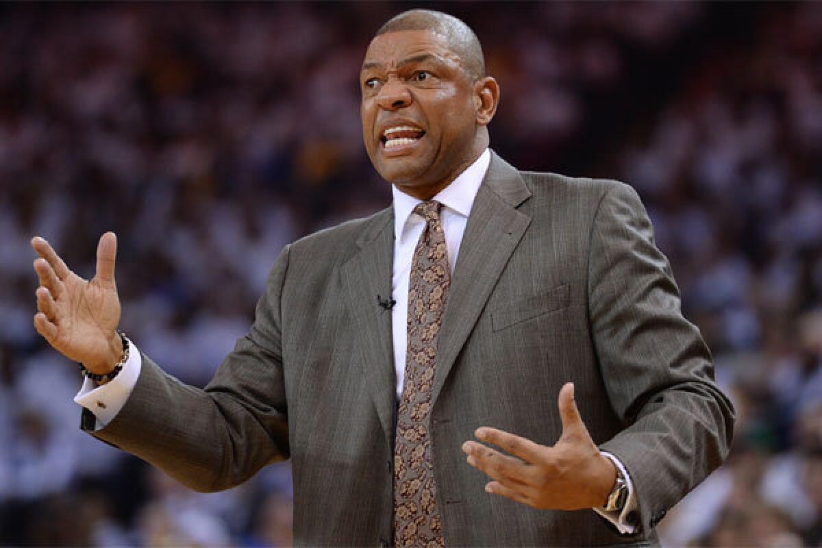 Clippers Coach Doc Rivers reacts to a foul called against his team while playing at Golden State.