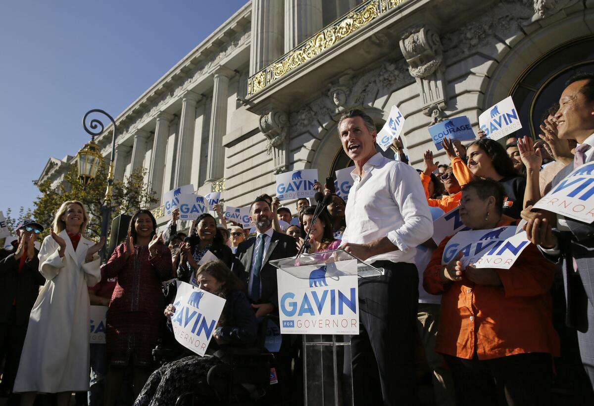 Gavin Newsom speaks during a bus tour kickoff outside San Francisco City Hall on Tuesday.