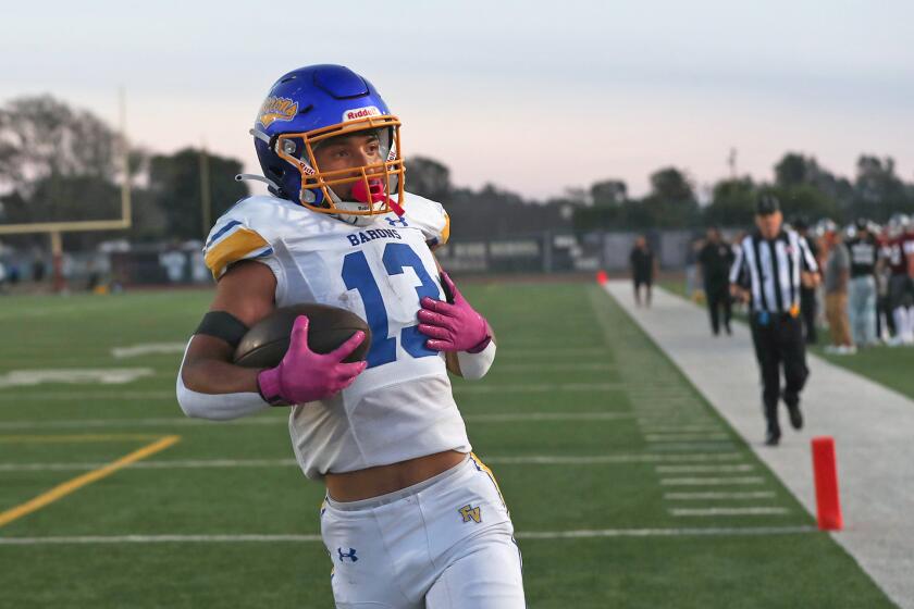 Fountain Valley running back Nolan Olivares (13) walks into the endzone.