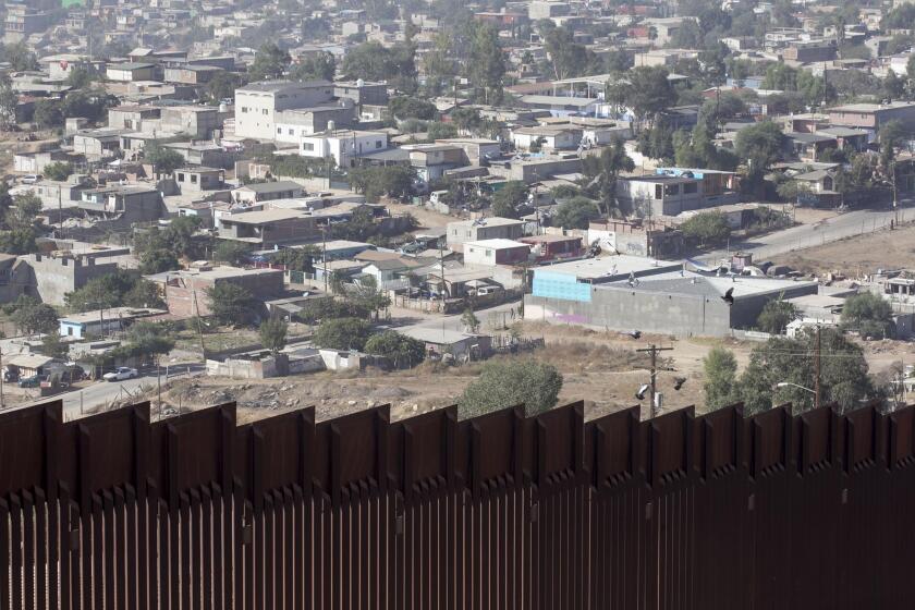 The Tijuana suburbs are shown behind the primary border fence at the US-Mexico Border at Otay Mesa in San Diego on Tuesday, October 15, 2019.