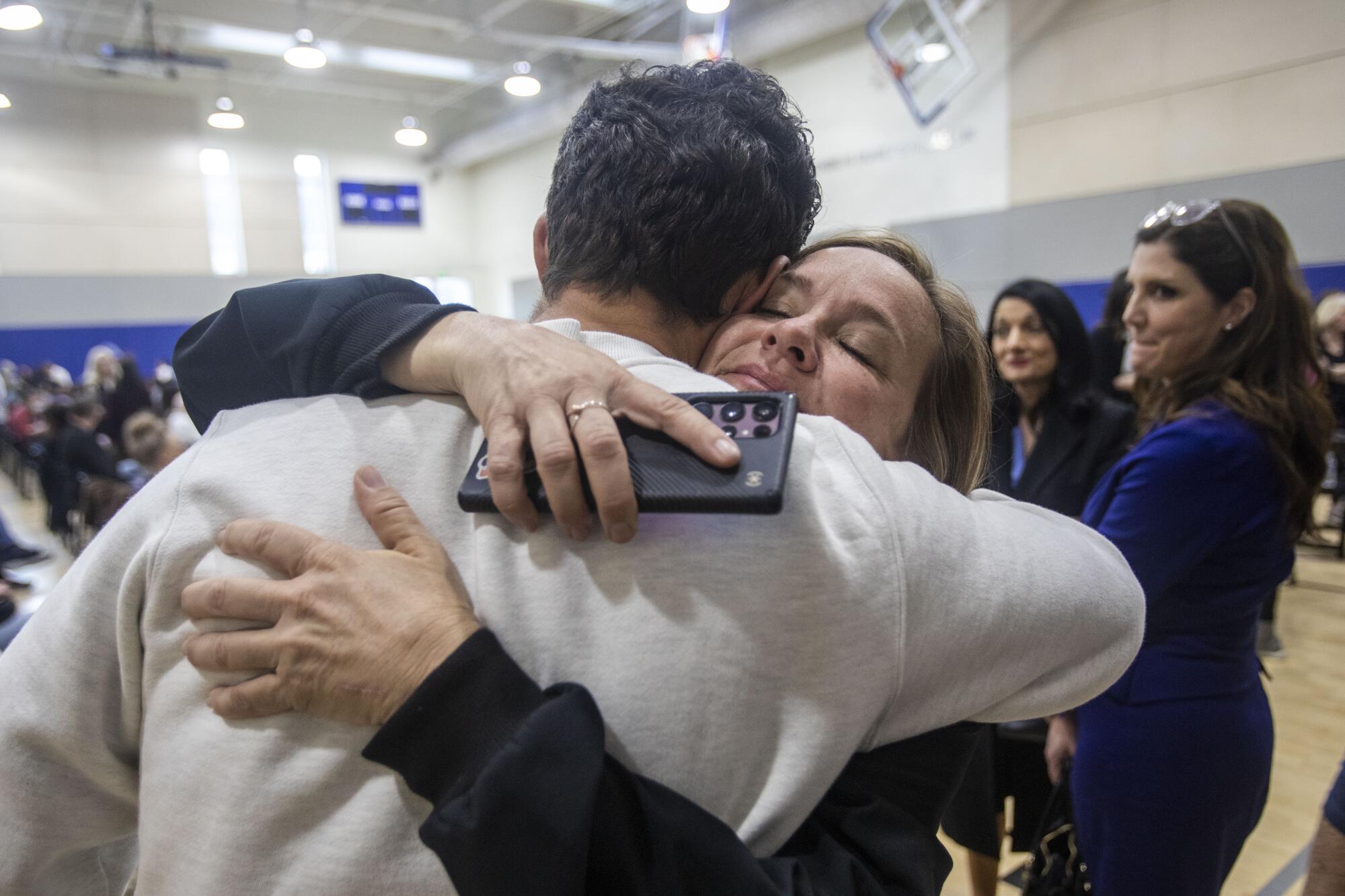 Los Angeles City Councilmember Traci Park hugs an attendee at a charity gathering at Collins & Katz Family YMCA on Jan. 21.