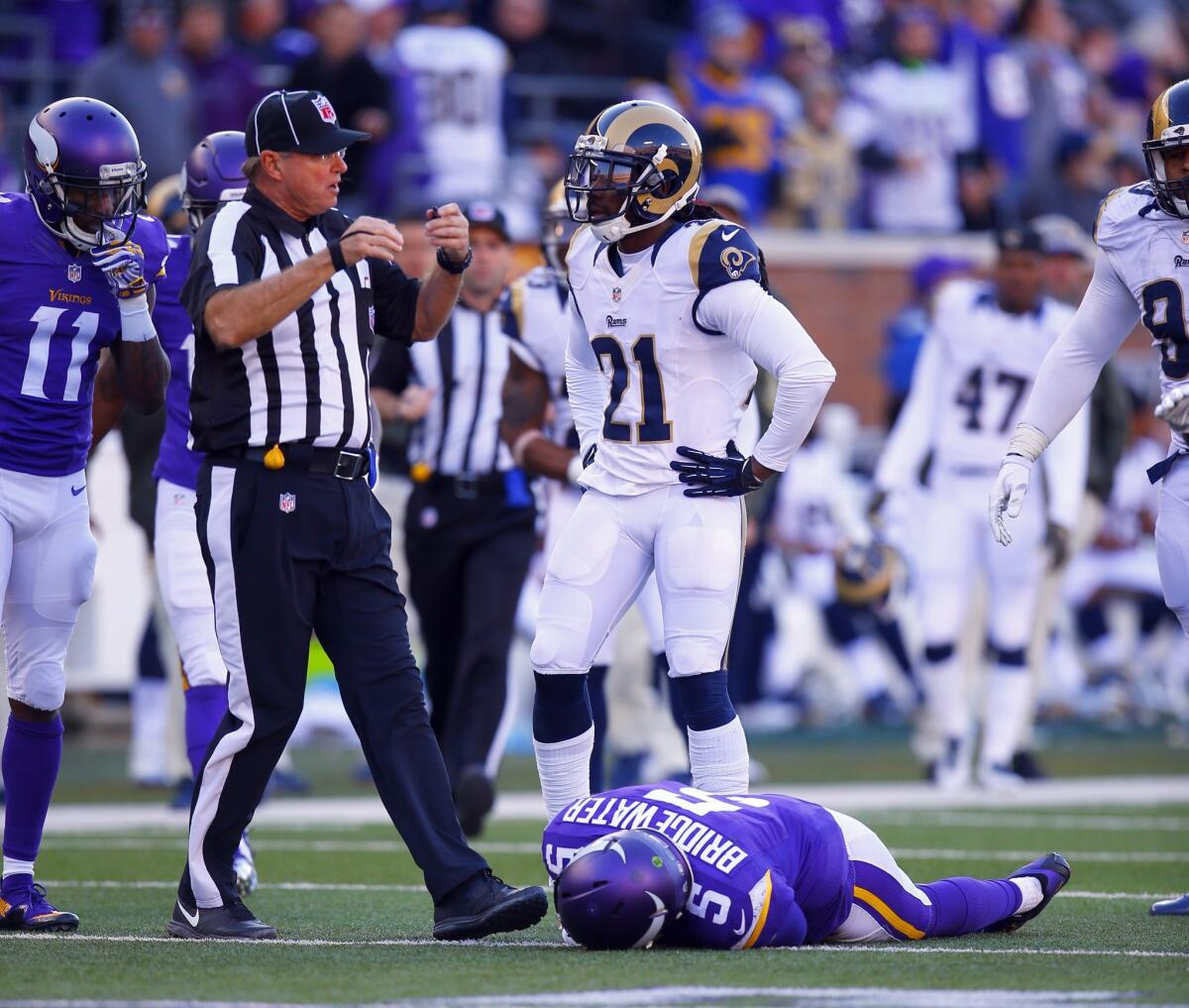 Minnesota Vikings quarterback Teddy Bridgewater (5) lies on the field after a tackle to his head by St. Louis Rams cornerback Lamarcus Joyner during an NFL football game Sunday, Nov. 8, 2015.